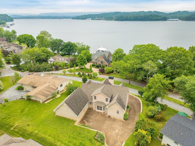 drone / aerial view featuring a water view and a residential view