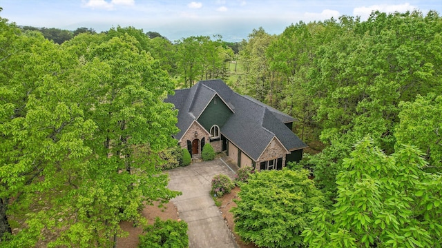 drone / aerial view with a view of trees