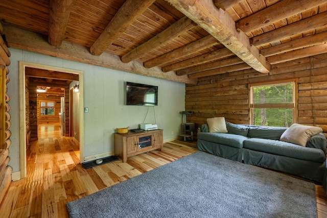 living area with light wood-style floors, wooden ceiling, and beamed ceiling