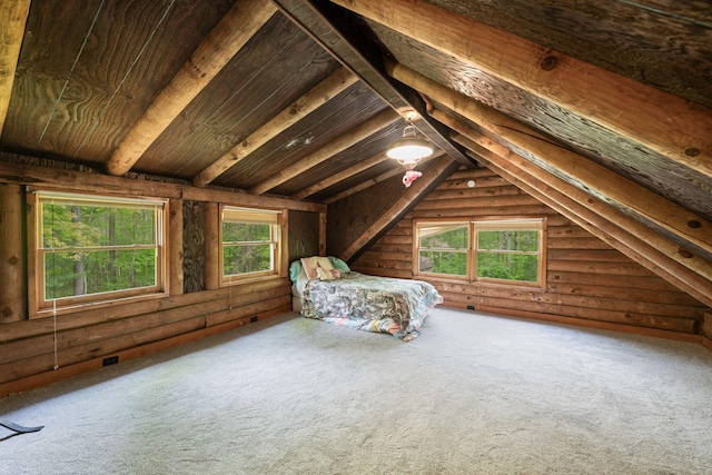 interior space with vaulted ceiling with beams, wood ceiling, and rustic walls