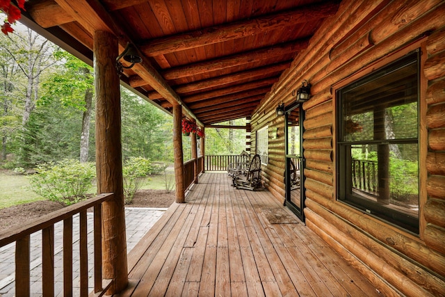 wooden terrace with a porch