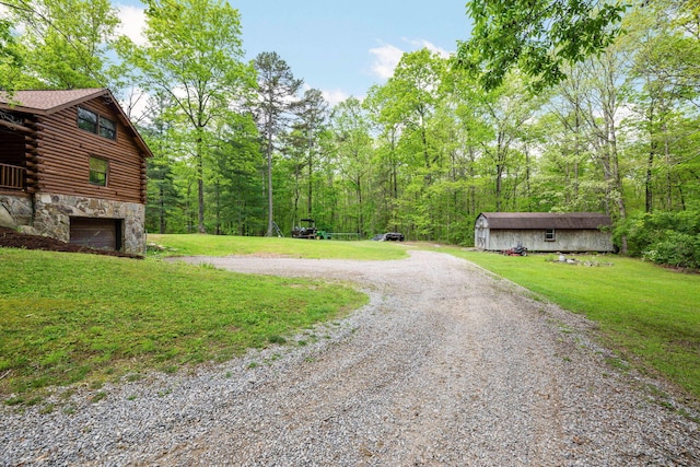view of street featuring a view of trees and driveway
