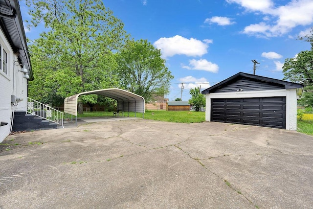 detached garage with a detached carport
