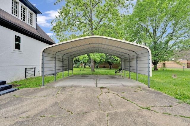 view of parking / parking lot with a detached carport and driveway