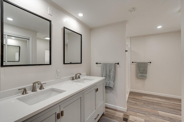 full bath featuring recessed lighting, a sink, and wood finished floors