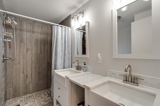 bathroom featuring vanity and a tile shower