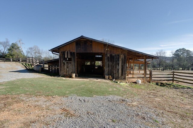 view of outbuilding featuring an outdoor structure and an exterior structure