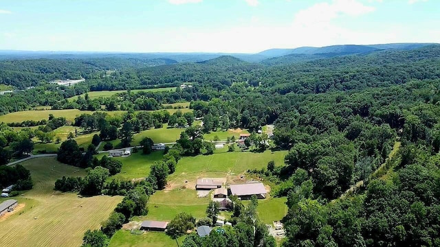 bird's eye view featuring a forest view