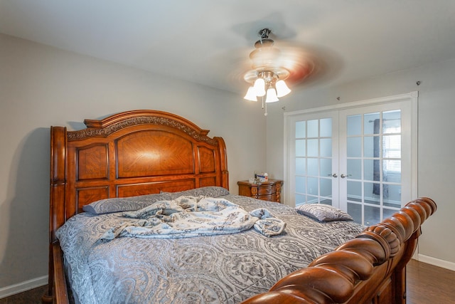 bedroom with ceiling fan, baseboards, french doors, and wood finished floors