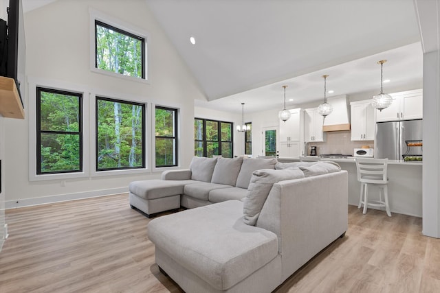 490 Moonlight Ln, Jasper, TN 37347 - living room with high vaulted ceiling, light wood-style floors, and recessed lighting