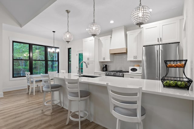490 Moonlight Ln, Jasper, TN 37347 - kitchen featuring a sink, freestanding refrigerator, premium range hood, white microwave, and stove