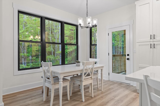 490 Moonlight Ln, Jasper, TN 37347 - dining space with a chandelier, light wood-style floors, and baseboards