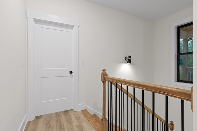 490 Moonlight Ln, Jasper, TN 37347 - corridor featuring an upstairs landing, light wood-type flooring, and baseboards