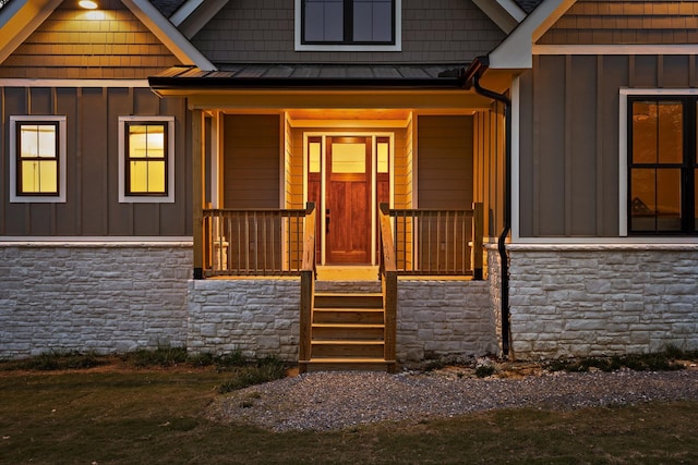 490 Moonlight Ln, Jasper, TN 37347 - view of exterior entry featuring stone siding, board and batten siding, and a standing seam roof
