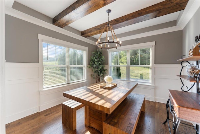 dining area featuring a decorative wall, a notable chandelier, a wealth of natural light, and beamed ceiling
