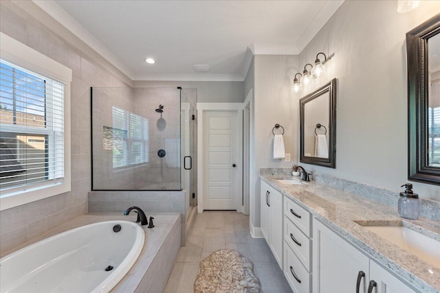full bathroom with a sink, double vanity, ornamental molding, a garden tub, and a stall shower