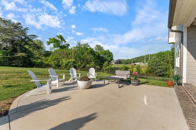 view of patio with a fire pit