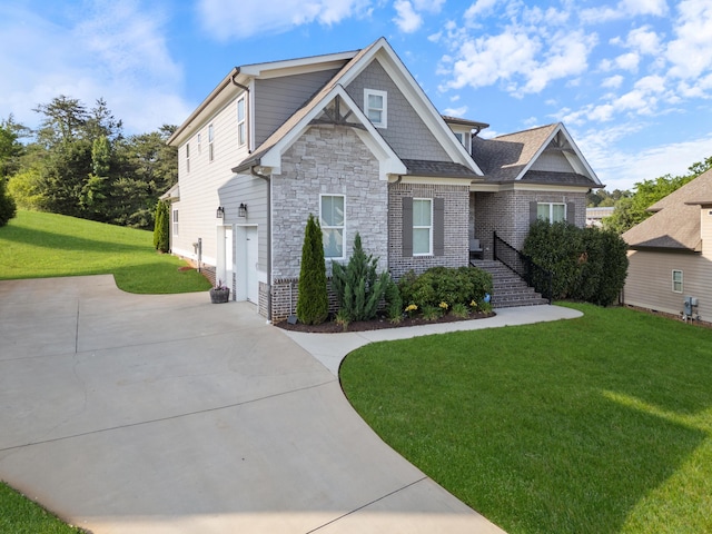 craftsman house with stone siding and a front lawn