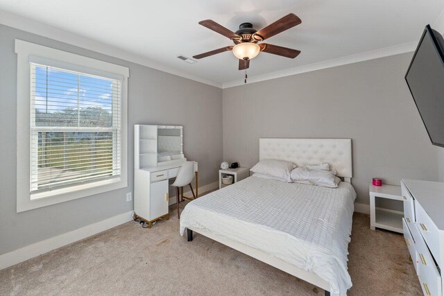 bedroom with crown molding, light colored carpet, a ceiling fan, baseboards, and visible vents