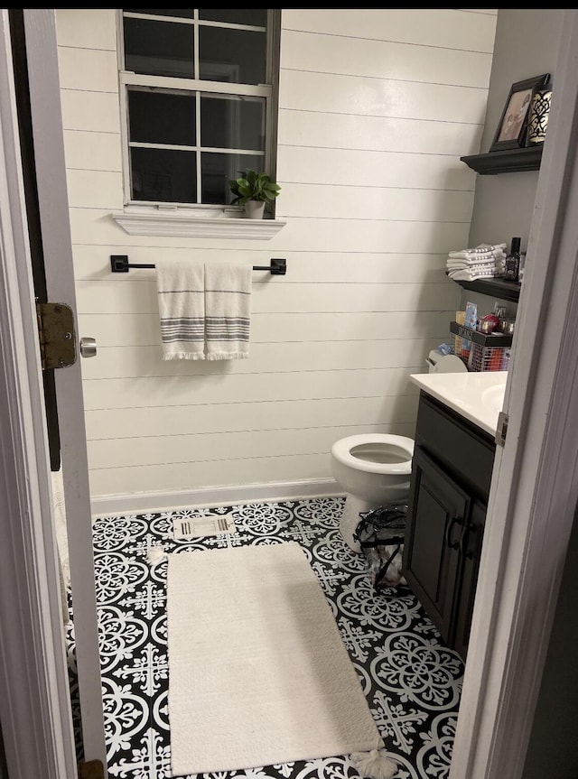 8721 Forest Pond Dr, Harrison, TN 37341 - half bath with vanity, toilet, and wood walls