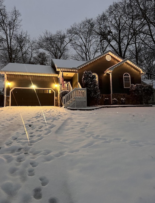8721 Forest Pond Dr, Harrison, TN 37341 - view of front facade featuring aphalt driveway and a garage