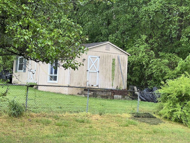view of shed with fence