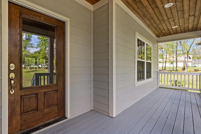 property entrance featuring covered porch