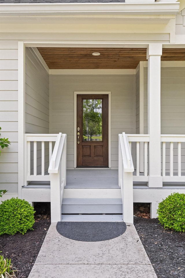 doorway to property with a porch