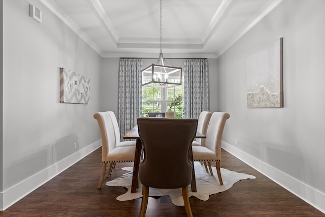dining area featuring baseboards, crown molding, a chandelier, and a tray ceiling