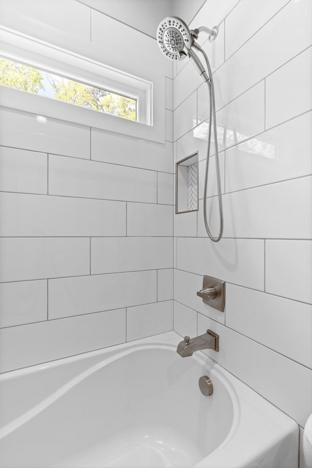 bathroom with shower / bathtub combination
