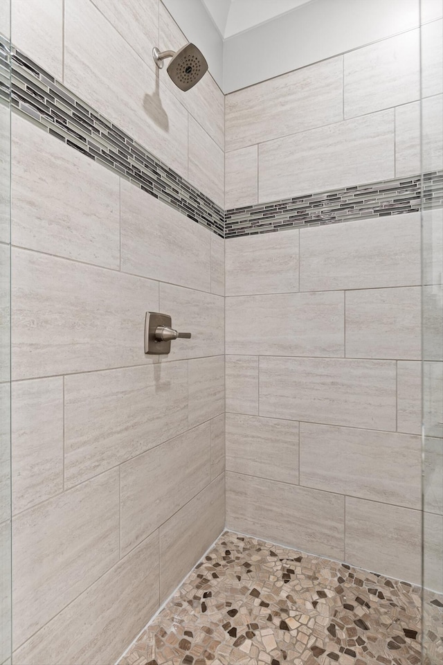 full bath featuring a tile shower