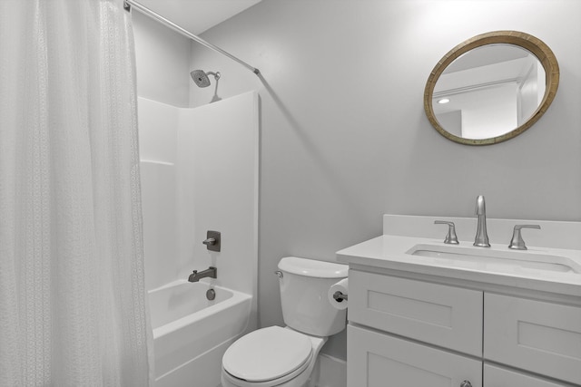 bathroom with vanity, shower / bath combo with shower curtain, and toilet