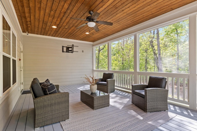sunroom with ceiling fan and outdoor lounge area