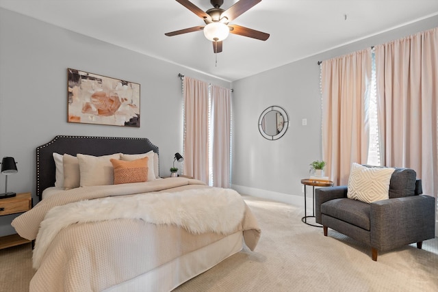 bedroom featuring carpet floors, baseboards, and ceiling fan