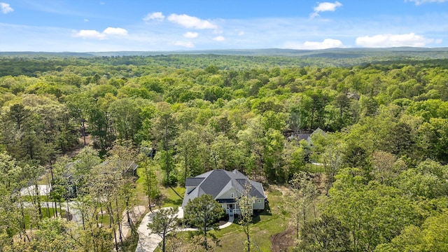 birds eye view of property with a forest view