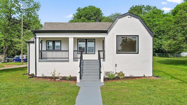 2917 Crescent Cir, Chattanooga, TN 37407 - view of front of house featuring a front lawn, roof with shingles, and stucco siding