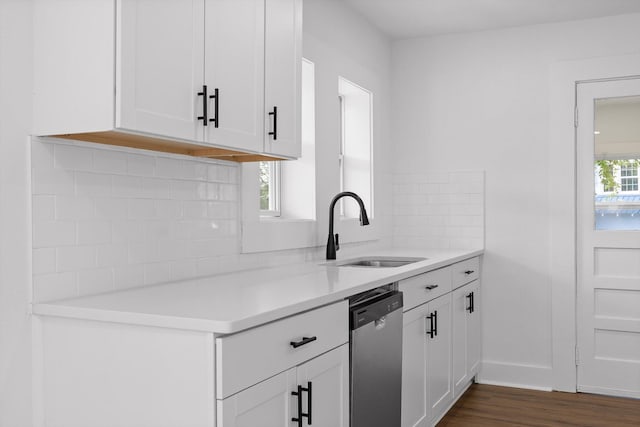 2917 Crescent Cir, Chattanooga, TN 37407 - kitchen featuring dishwasher, a sink, light countertops, dark wood-style floors, and white cabinetry