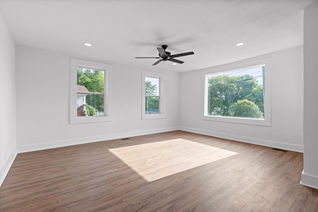 2917 Crescent Cir, Chattanooga, TN 37407 - unfurnished room featuring visible vents, baseboards, ceiling fan, and wood finished floors