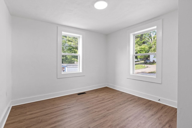 2917 Crescent Cir, Chattanooga, TN 37407 - empty room featuring plenty of natural light, wood finished floors, and visible vents