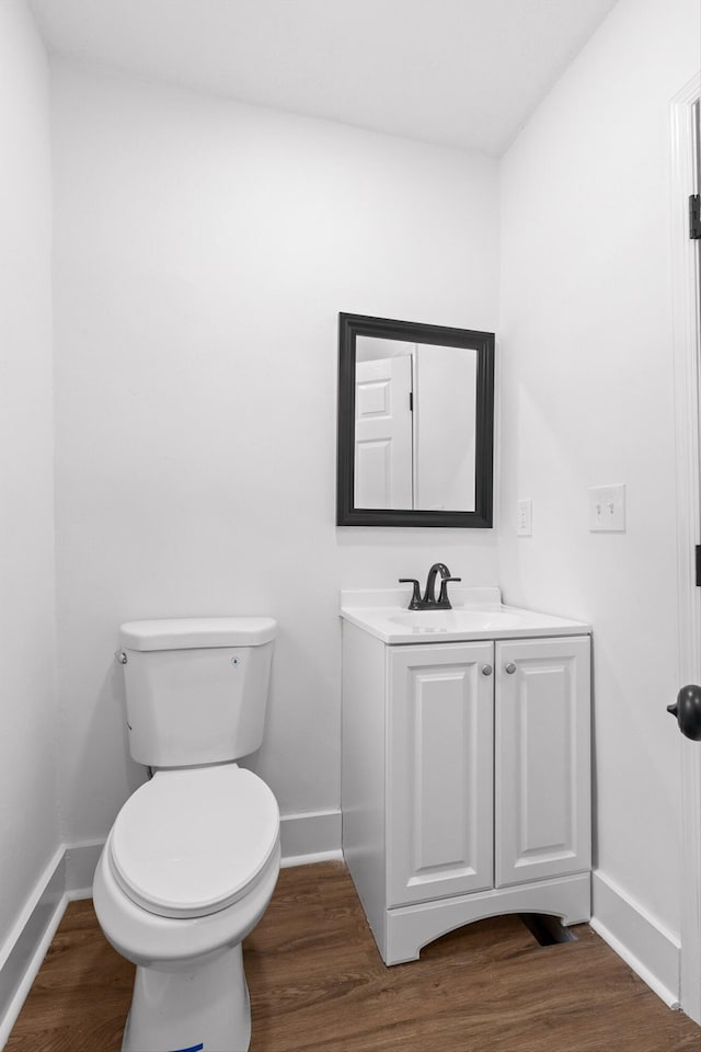 2917 Crescent Cir, Chattanooga, TN 37407 - half bathroom with baseboards, toilet, and wood finished floors