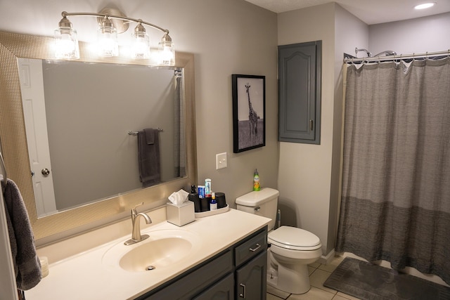 full bathroom featuring toilet, tile patterned floors, curtained shower, and vanity
