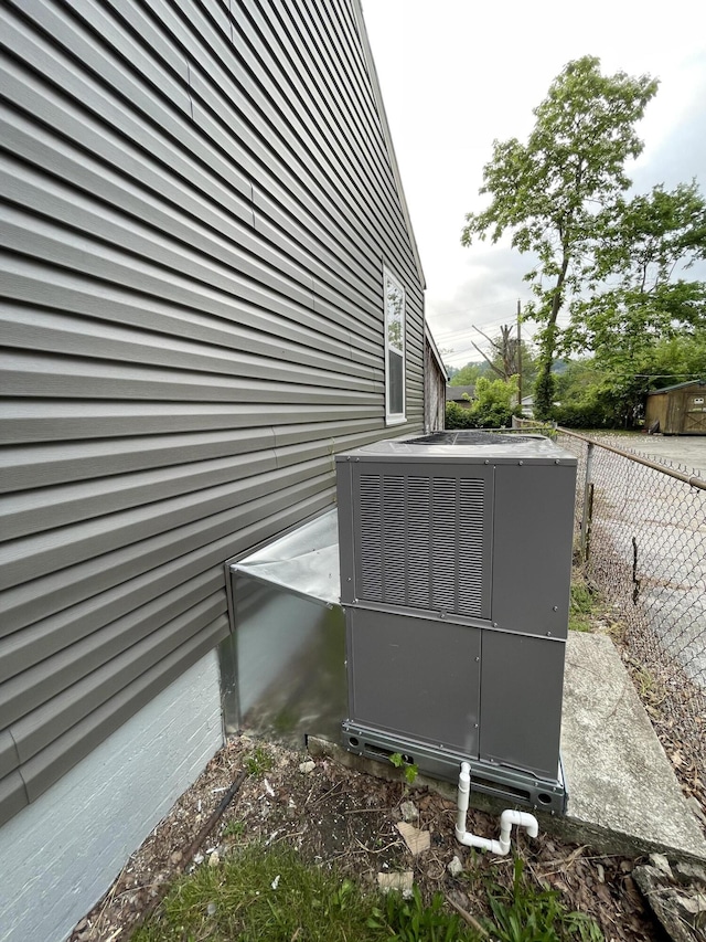 exterior details with fence and central AC unit