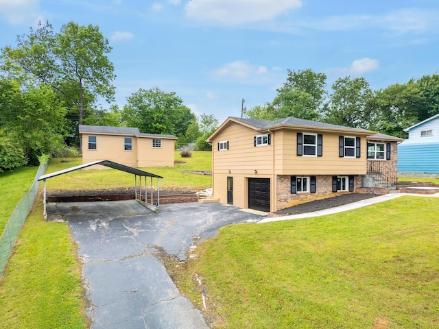 1852 N Prairie Cir, Hixson, TN 37343 - view of front of property with asphalt driveway, a carport, a front lawn, and a garage