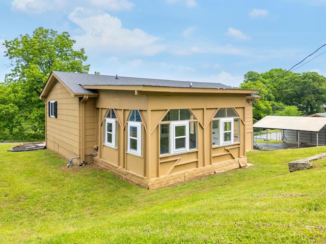 1852 N Prairie Cir, Hixson, TN 37343 - back of property featuring a detached carport and a yard