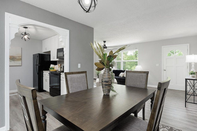 1852 N Prairie Cir, Hixson, TN 37343 - dining space featuring light wood-style floors, baseboards, and a ceiling fan