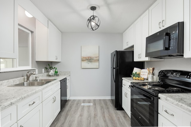 1852 N Prairie Cir, Hixson, TN 37343 - kitchen with black appliances, a sink, white cabinetry, and light wood-style flooring