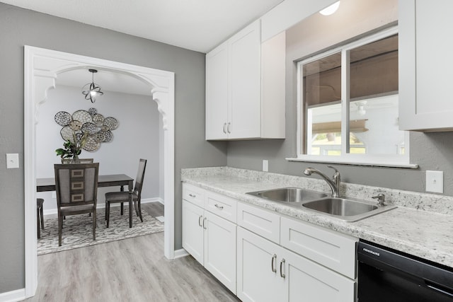 1852 N Prairie Cir, Hixson, TN 37343 - kitchen with dishwasher, a sink, light countertops, light wood-style flooring, and white cabinetry