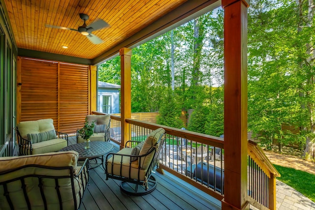 deck with ceiling fan and an outdoor hangout area