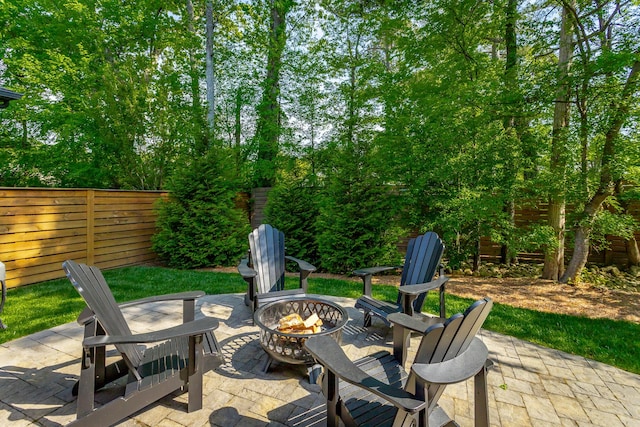 view of patio with fence and an outdoor fire pit