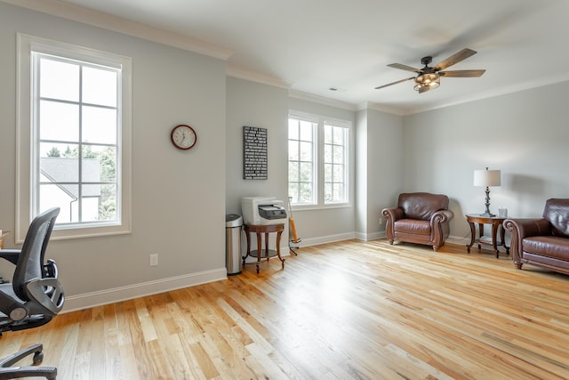 office area featuring crown molding, a ceiling fan, baseboards, wood finished floors, and visible vents